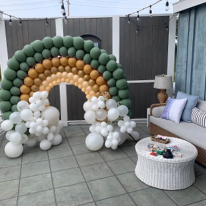 Elegant rainbow balloon display for a baby shower hosted at Verandas Beach House.