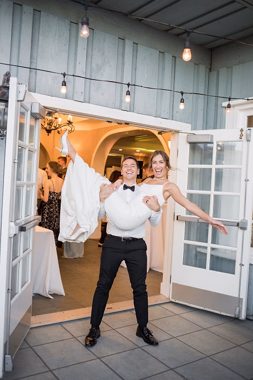 Groom Carries New Bride