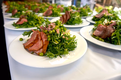 Seared Duck Frisee with arugula and peas salad