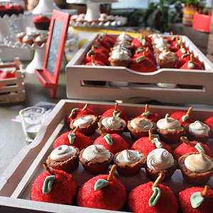 Apple cupcakes and s'mores bites with graham cracker crust on dessert display