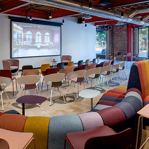 Event Space With Tables and 159″ Projection Screen With 4K Projector & Apple TV