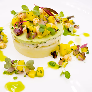 Peruvian Crab Causa with ajillo potato puree, crab salad, avocado puree, mango salsa, cilantro oil