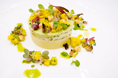 Peruvian Crab Causa with ajillo potato puree, crab salad, avocado puree, mango salsa, cilantro oil