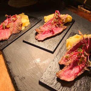Plated Roasted Beef and Vegan "Steak" Au Poivre