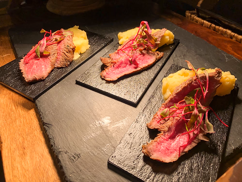 Plated Roasted Beef and Vegan "Steak" Au Poivre