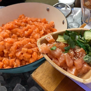 Pot of Yuzu Salmon, and a plated portion in a palm bowl