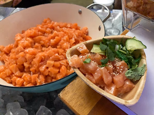 Pot of Yuzu Salmon, and a plated portion in a palm bowl