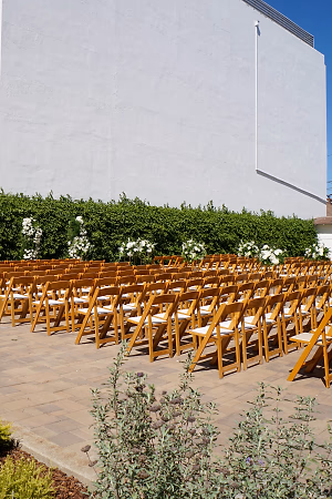 Wedding Ceremony Setup with Folding Chairs in the Plaza