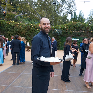 Server Passing in an Outdoor Event