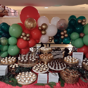 A Holiday Dessert Display with Balloons and Bites
