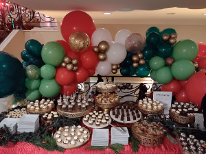 A Holiday Dessert Display with Balloons and Bites