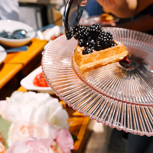 Guest Adding Toppings to Waffle