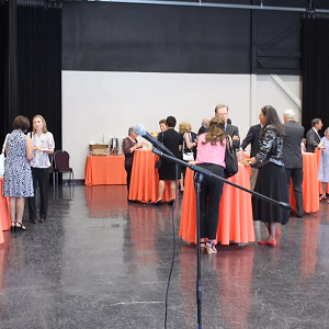 Guests talking amongst cocktail tables