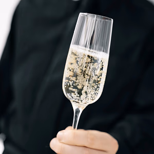 Server Handing Glass of Champagne